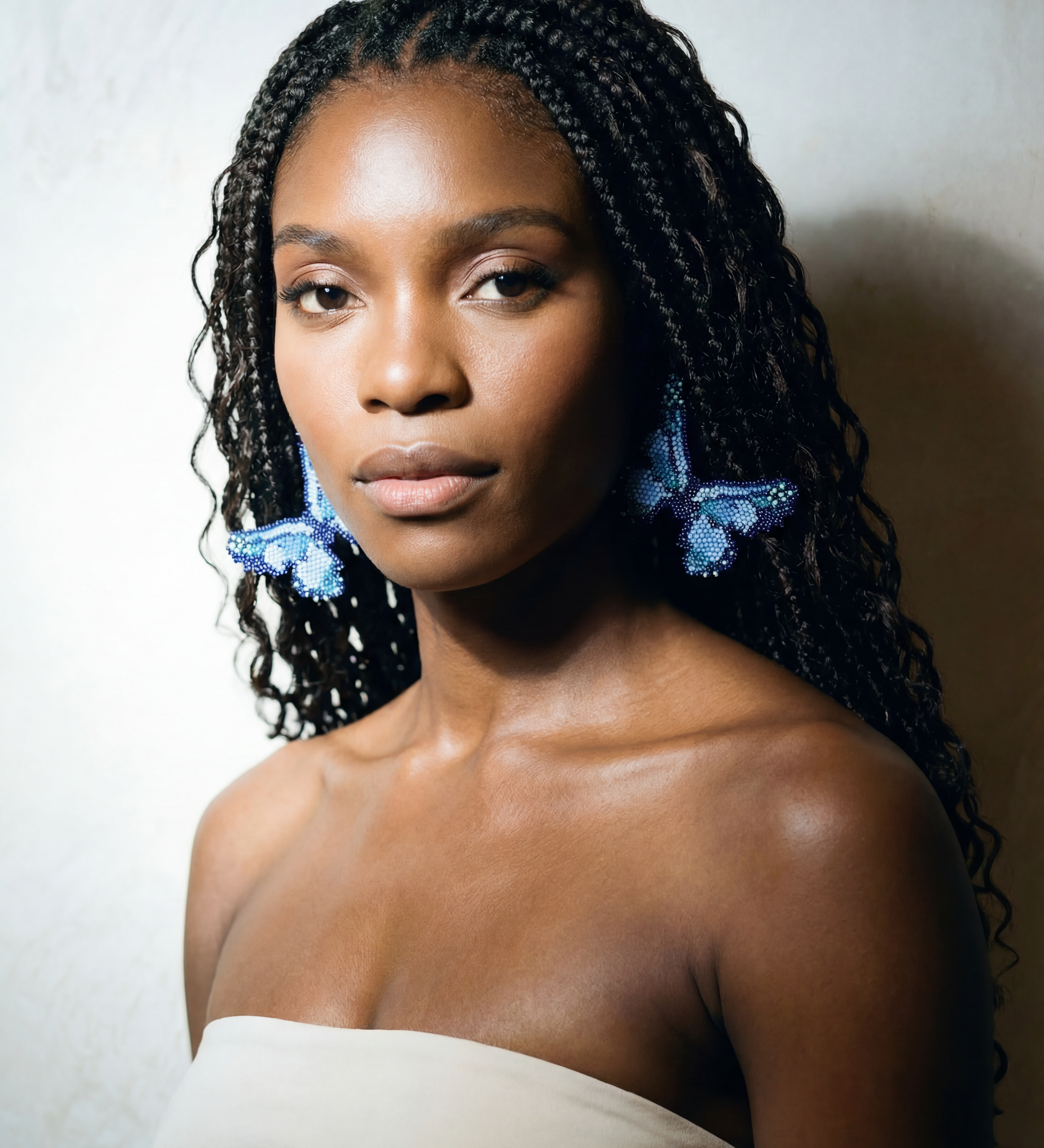 Model wearing Purple Emperor Bagabaga beaded butterfly earrings