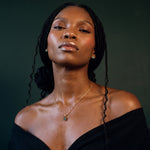 Raw emerald set worn, close up